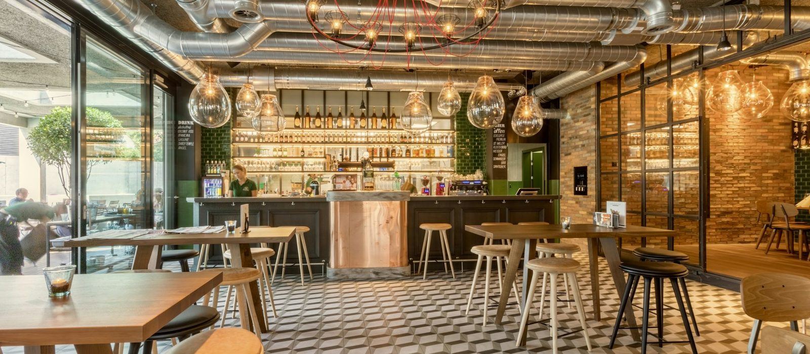 A restaurant bar and dining area during setup